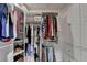 Spacious walk-in closet with custom shelving, storage solutions, and organized clothing racks at 248 Riverview Trl, Roswell, GA 30075