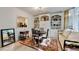 Cozy dining area features built-in shelves, a round table, and a daybed near a bright window at 248 Riverview Trl, Roswell, GA 30075