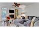 Inviting living room with a brick fireplace, plush sofa, and a door leading to outdoor views at 248 Riverview Trl, Roswell, GA 30075