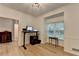 Bright home office featuring light wood flooring, a workstation, and a large window overlooking the front yard at 248 Riverview Trl, Roswell, GA 30075