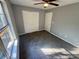 Bedroom with plush carpet, ample natural light, and lots of storage space provides a cozy retreat at 2572 Laurel Cir, Atlanta, GA 30311