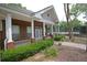 Clubhouse exterior with brick, white columns, landscaping and tennis courts at 2572 Laurel Cir, Atlanta, GA 30311