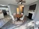 Cozy dining area featuring a fireplace and adjacent kitchen with modern appliances at 2572 Laurel Cir, Atlanta, GA 30311