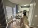 Bright kitchen and breakfast nook with white cabinets and stainless steel appliances at 2572 Laurel Cir, Atlanta, GA 30311