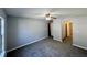 Spacious living room featuring neutral paint, plush carpeting, and a ceiling fan, bathed in natural light at 2572 Laurel Cir, Atlanta, GA 30311