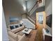 Inviting living room with staircase, neutral colors, stylish decor, and abundant natural light at 2572 Laurel Cir, Atlanta, GA 30311