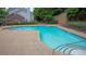 Enjoy the community pool with lounge chairs and mature trees surrounding the area at 2572 Laurel Cir, Atlanta, GA 30311