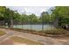 Community tennis courts with new black fencing and lush green trees at 2572 Laurel Cir, Atlanta, GA 30311