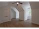 Bright bedroom features hardwood floors, ceiling fan, white trim and a window at 3007 Holly St, Canton, GA 30115