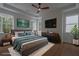 Staged bedroom with ceiling fan, modern decor, and natural light at 3007 Holly St, Canton, GA 30115