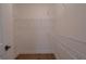 Walk-in closet featuring custom shelving and wood flooring at 3007 Holly St, Canton, GA 30115