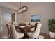 Elegant dining room featuring a stylish chandelier, hardwood floors, and comfortable seating for gatherings at 3007 Holly St, Canton, GA 30115
