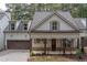 Charming two-story home with a two-car garage and inviting front porch in a desirable neighborhood at 3007 Holly St, Canton, GA 30115