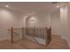 Upstairs hallway with modern railings and hardwood floors at 3007 Holly St, Canton, GA 30115