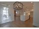 Open concept kitchen with large island, stainless steel appliances, and modern lighting fixtures at 3007 Holly St, Canton, GA 30115