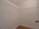 Walk-in closet with wire shelving and hardwood floors at 3007 Holly St, Canton, GA 30115