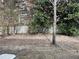 Backyard with lush green trees and a wooden fence at 20 Pine Canyon Sw Dr # 41, Atlanta, GA 30331