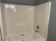 Bathroom shower and tub area with white tiling and showerhead at 20 Pine Canyon Sw Dr # 41, Atlanta, GA 30331