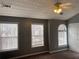 Bright bedroom with a fan, multiple windows, and view of neighborhood homes at 20 Pine Canyon Sw Dr # 41, Atlanta, GA 30331