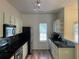 Efficient kitchen with stainless steel appliances, black countertops, and ample cabinet space at 20 Pine Canyon Sw Dr # 41, Atlanta, GA 30331