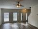 Bright living room featuring hardwood floors, large windows, and a ceiling fan at 20 Pine Canyon Sw Dr # 41, Atlanta, GA 30331
