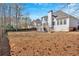 An expansive backyard featuring a privacy fence and a view of the home's rear elevation at 2021 Cockrell Pointe Nw, Kennesaw, GA 30152