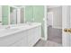 Bathroom featuring double vanity, tile floors, and green painted walls at 2021 Cockrell Pointe Nw, Kennesaw, GA 30152