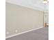 A spacious bedroom with neutral carpeting and a ceiling fan at 2021 Cockrell Pointe Nw, Kennesaw, GA 30152