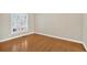 Bright bedroom with hardwood floors, plantation shutters, and neutral paint at 2021 Cockrell Pointe Nw, Kennesaw, GA 30152