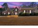 Charming brick home featuring manicured landscaping and a well-maintained front lawn at 2021 Cockrell Pointe Nw, Kennesaw, GA 30152