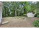Large backyard with storage shed surrounded by mature trees at 2765 Ocean Valley Dr, Atlanta, GA 30349