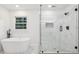 Elegant bathroom with a soaking tub and glass-enclosed shower, great natural light at 2765 Ocean Valley Dr, Atlanta, GA 30349