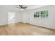 Spacious bedroom with hardwood floors, modern ceiling fan, and en-suite bathroom at 2765 Ocean Valley Dr, Atlanta, GA 30349