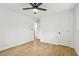 Bedroom featuring a ceiling fan, wood-look flooring, and multiple closets at 2765 Ocean Valley Dr, Atlanta, GA 30349