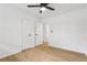 A clean bedroom with ceiling fan and light-colored wood-look flooring at 2765 Ocean Valley Dr, Atlanta, GA 30349