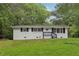 Charming one-story home with black shutters, landscaped yard and inviting entry at 2765 Ocean Valley Dr, Atlanta, GA 30349