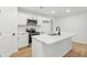 Bright kitchen featuring an island, stainless appliances, and white cabinets at 2765 Ocean Valley Dr, Atlanta, GA 30349