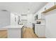Bright kitchen featuring an island, stainless appliances, and white cabinets at 2765 Ocean Valley Dr, Atlanta, GA 30349