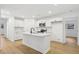 Bright kitchen featuring an island, stainless appliances, and white cabinets at 2765 Ocean Valley Dr, Atlanta, GA 30349