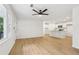 Open floor plan featuring modern kitchen, recessed lights, and light hardwood flooring at 2765 Ocean Valley Dr, Atlanta, GA 30349