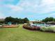 Full view of the playground and pool, offering a variety of recreational options at Village Grove at 4400 Village Field Pl, Suwanee, GA 30024