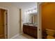 Bathroom featuring a double sink vanity with dark wood cabinets at 4400 Village Field Pl, Suwanee, GA 30024