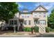 Inviting townhome with charming front porch and well-maintained landscaping in a desirable neighborhood at 4400 Village Field Pl, Suwanee, GA 30024