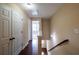 Hallway with hardwood floors, closet, and access to rooms at 4400 Village Field Pl, Suwanee, GA 30024