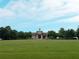 Expansive lawn area in Village Grove provides a beautiful vista and community green space at 4400 Village Field Pl, Suwanee, GA 30024