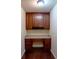 This office features hardwood floors, built in cabinets, drawers, and stone countertops at 4400 Village Field Pl, Suwanee, GA 30024
