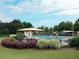 Community pool area featuring sunshades and lounge chairs for relaxing poolside in Village Grove at 4400 Village Field Pl, Suwanee, GA 30024