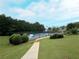 Tennis courts surrounded by greenery, offering an active lifestyle option in Village Grove at 4400 Village Field Pl, Suwanee, GA 30024