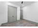 Bedroom featuring light gray trim, a ceiling fan, and a double door closet at 632 Hunters Cove Ln., Loganville, GA 30052