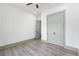 Neutral bedroom with light gray trim, ceiling fan, and double door closet at 632 Hunters Cove Ln., Loganville, GA 30052